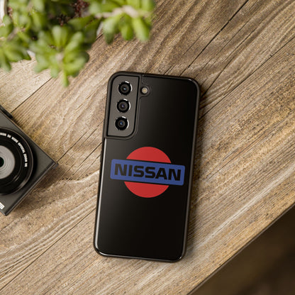 Black Samsung Galaxy S22 Vintage Nissan phone case on a table with accessories.