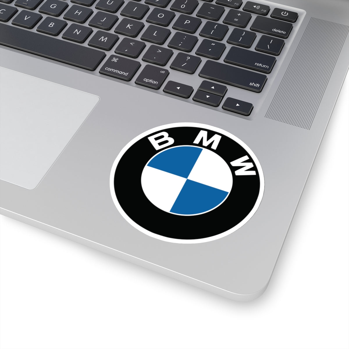 3 inch BMW sticker applied to a silver laptop, highlighting its siz