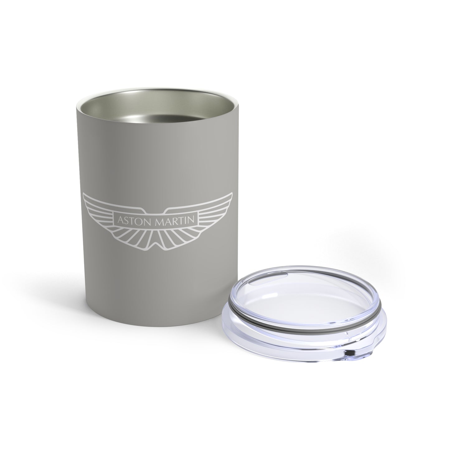 Front view of the Silver Birch Aston Martin Tumbler with the lid placed next to it.