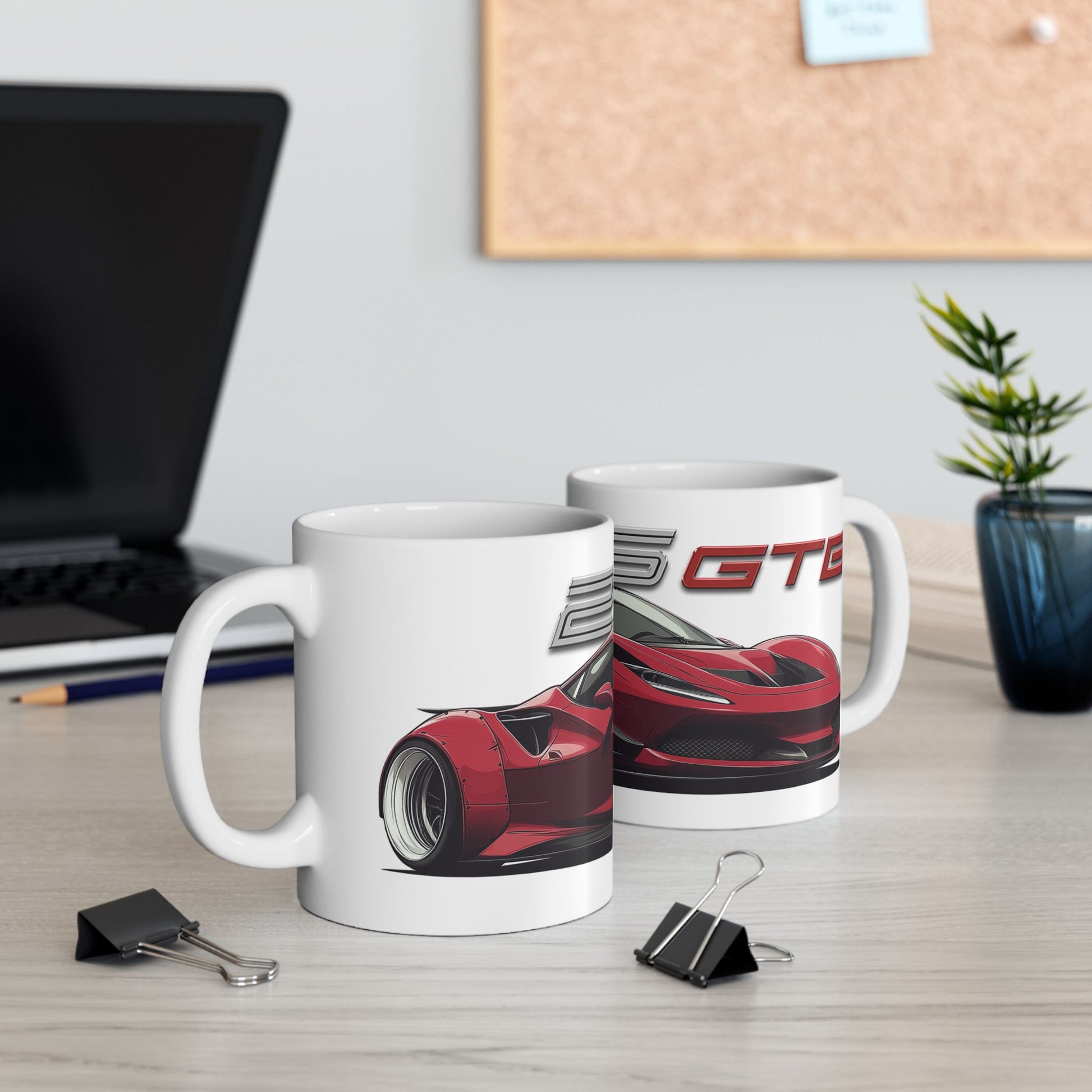 Lifestyle view of the 11oz White Coffee Mug with a Ferrari 296 GTB with the 296 GTB emblem placed behind the car. 