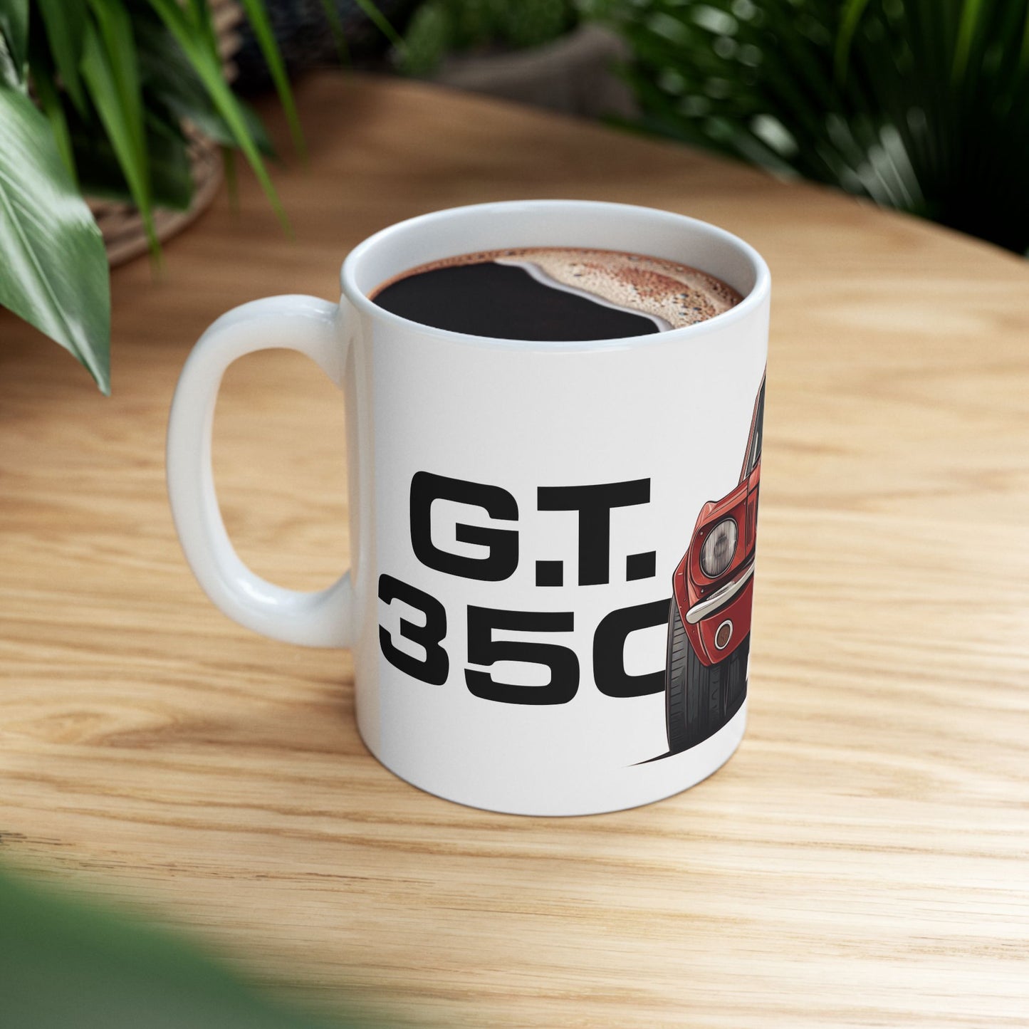 Lifestyle view of the 11oz White Coffee Mug with a red Ford GT350 with the text G.T. 350 placed beside the car. 