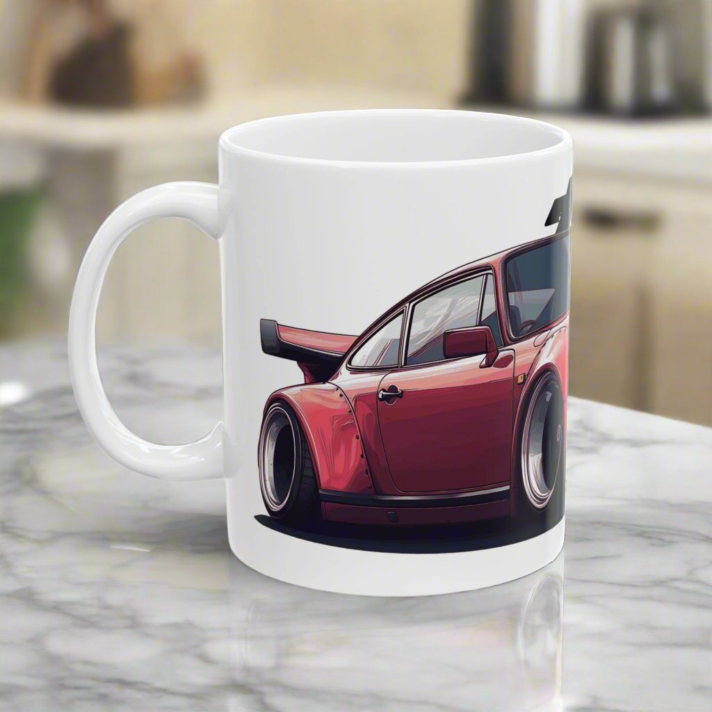 Left view of 11oz White Coffee Mug with a red Porsche 930 with the text 'turbo' placed behind the car. 