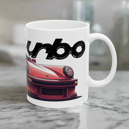 Right view of the 11oz White Coffee Mug with a red Porsche 930 with the text 'turbo' placed behind the car. 