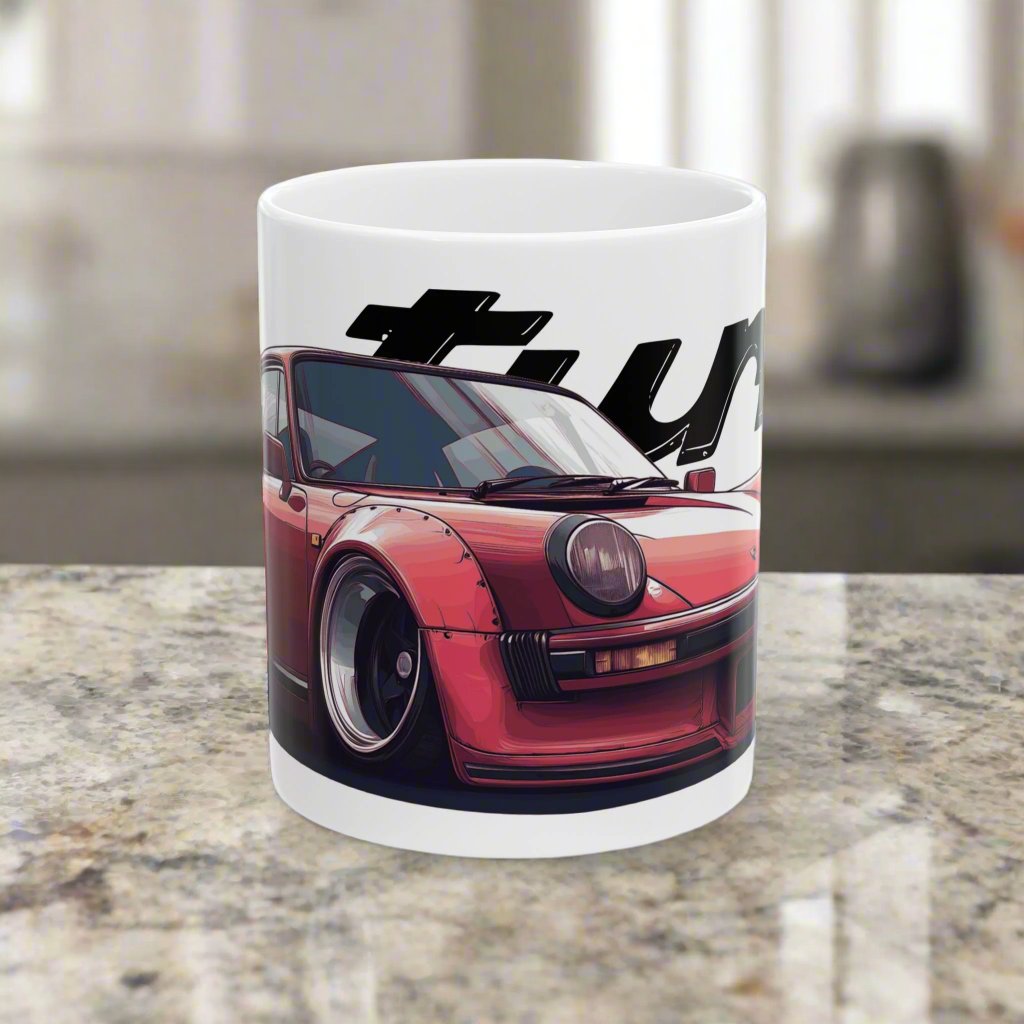 11oz White Coffee Mug with a red Porsche 930 with the text 'turbo' placed behind the car. 