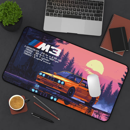 Top view of the 12 by 22 deskmat showing the BMW M3 E30 graphic with a mouse and laptop beside it.