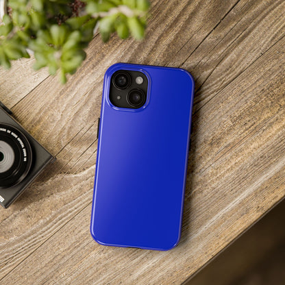 iPhone 15 BMW San Marino Blue phone case on a table with accessories. 