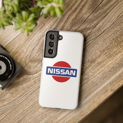 White Samsung Galaxy S22 Vintage Nissan phone case on a table with accessories.