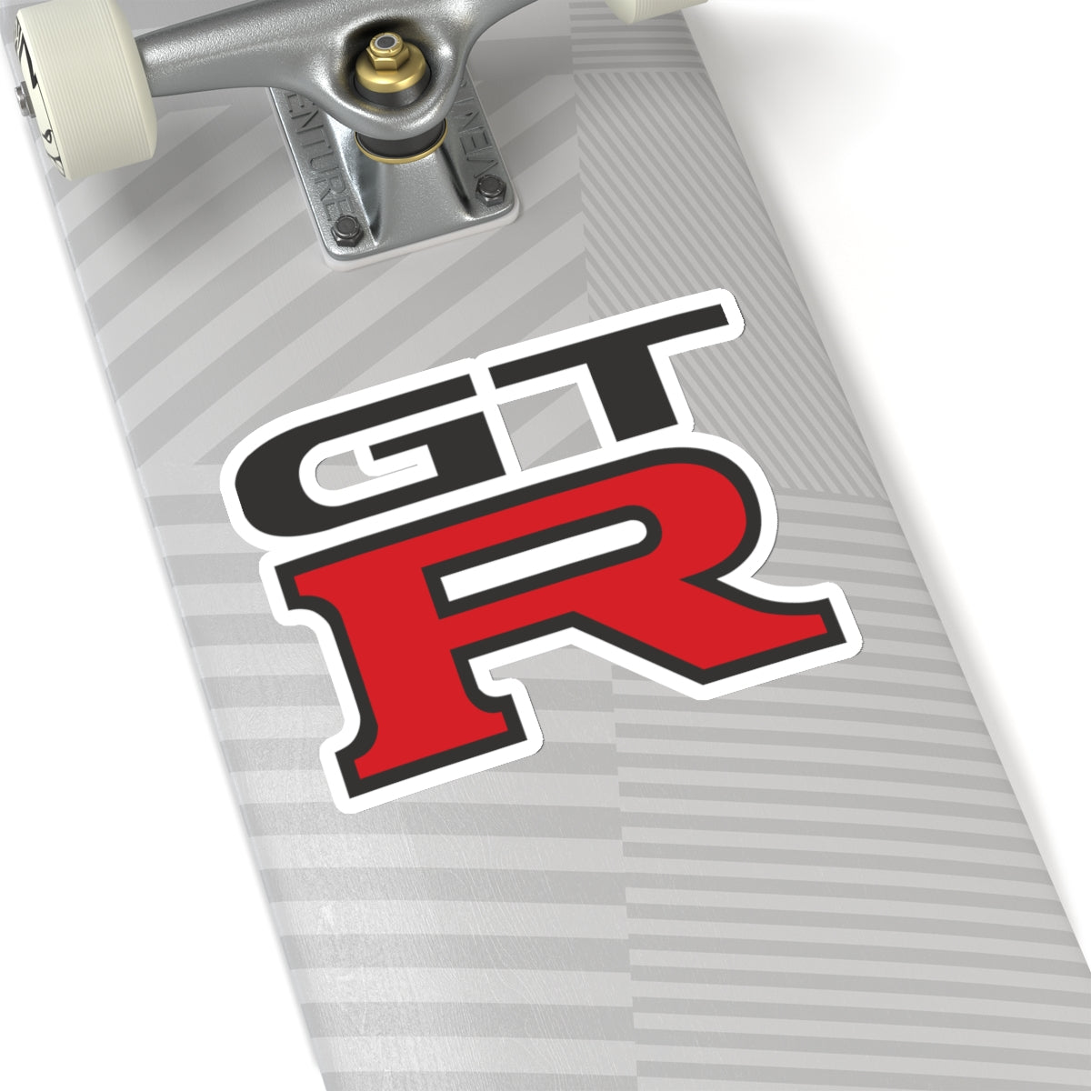 6 inch white GTR sticker on a silver skateboard deck