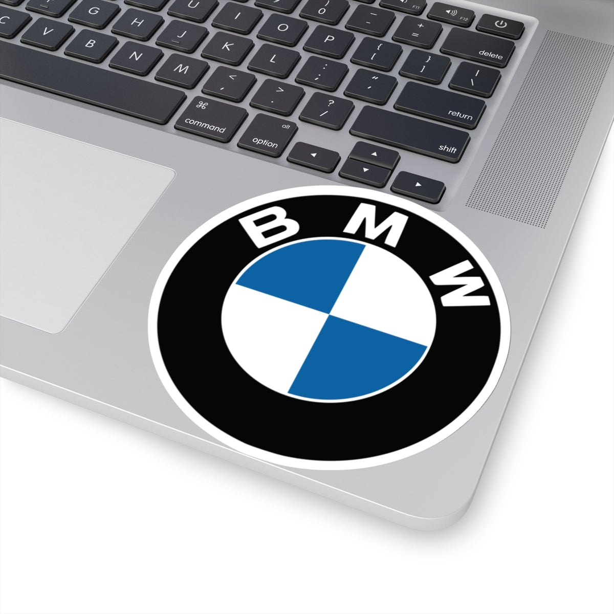 4 inch BMW sticker applied to a silver laptop, highlighting its siz