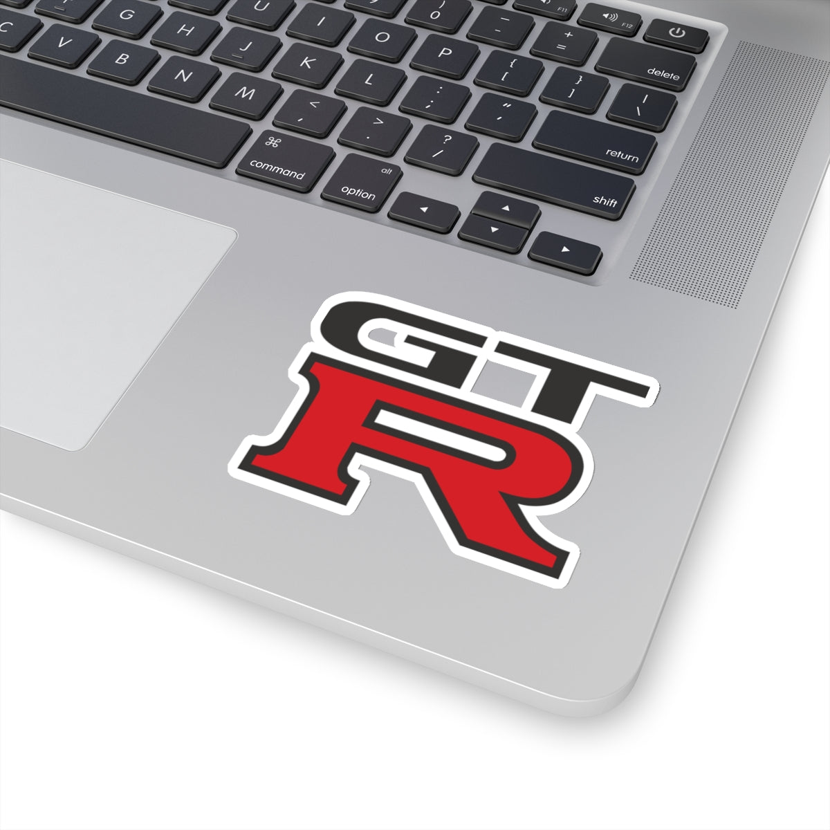 3 inch white GTR sticker on a silver laptop