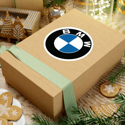 4 inch BMW sticker placed on a cardboard box.. 