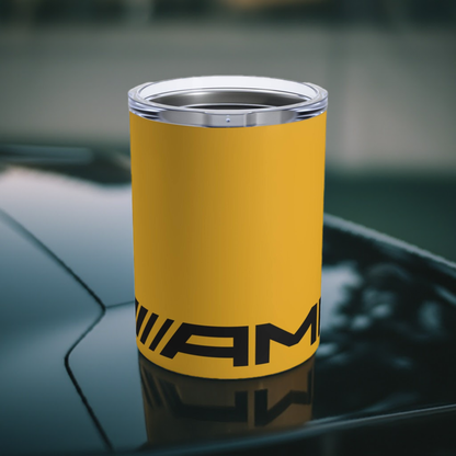 AMG tumbler in Solarbeam Yellow on a car with the AMG logo.