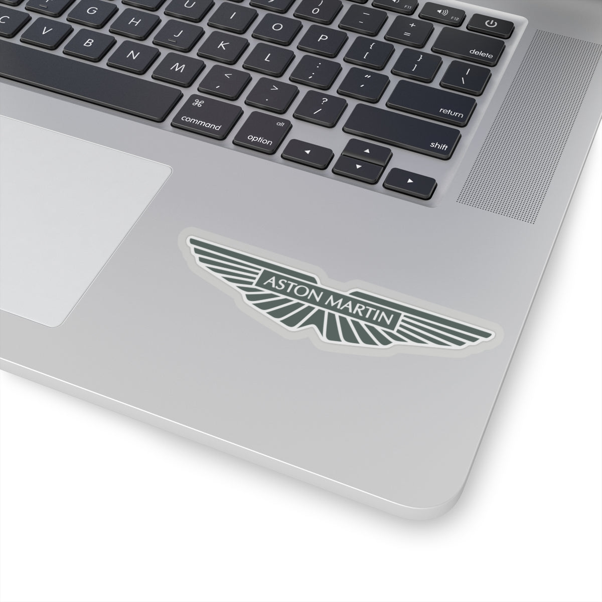 4 inch Aston Martin transparent sticker placed on a laptop.