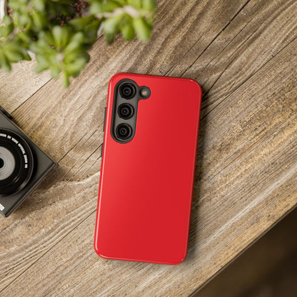 Samsung Galaxy S23 Max Aston Martin Volcano Red phone case on a table with accessories. 