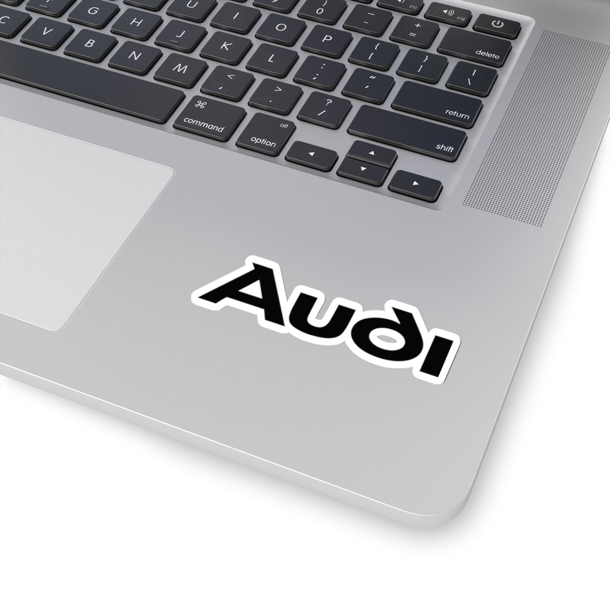 3 inch white sticker of the Audi logo on laptop for scale
