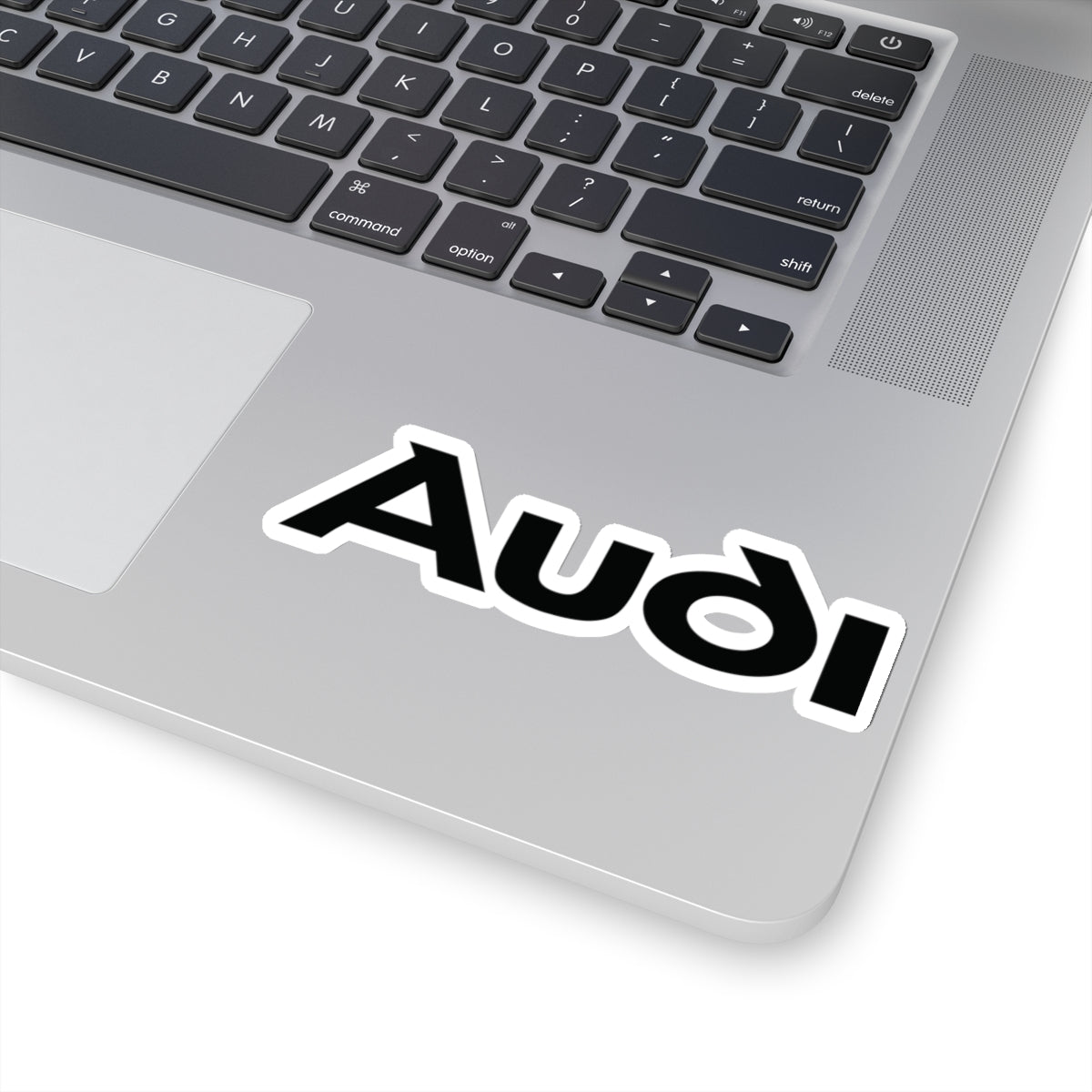 4 inch white sticker of the Audi logo on laptop for scale