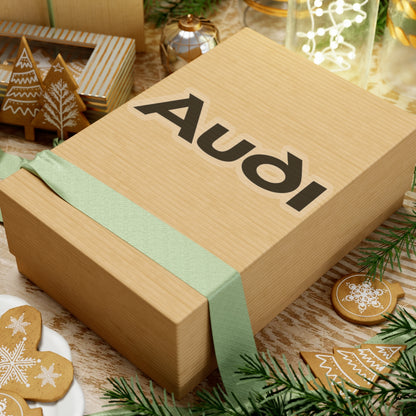 6 inch transparent sticker of the Audi logo on box for scale
