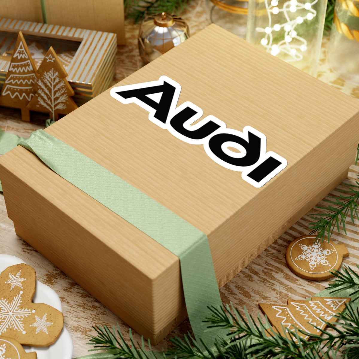 6 inch white sticker of the Audi logo on box for scale
