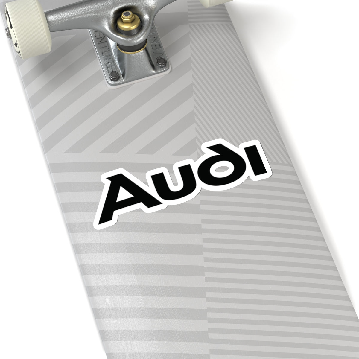 6 inch white sticker of the Audi logo on skateboard for scale
