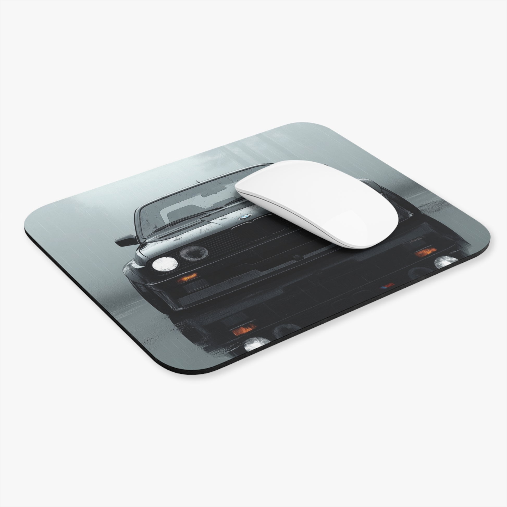 Angled view of the BMW E30 mouse pad on a white background