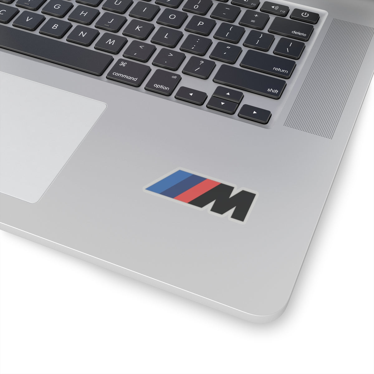 2 inch transparent sticker of the BMW Motorsport logo on laptop for scale
