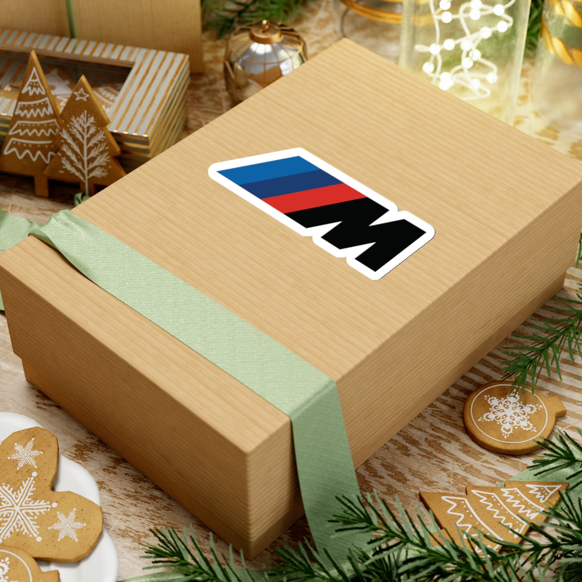 4 inch white sticker of the BMW Motorsport logo on box for scale
