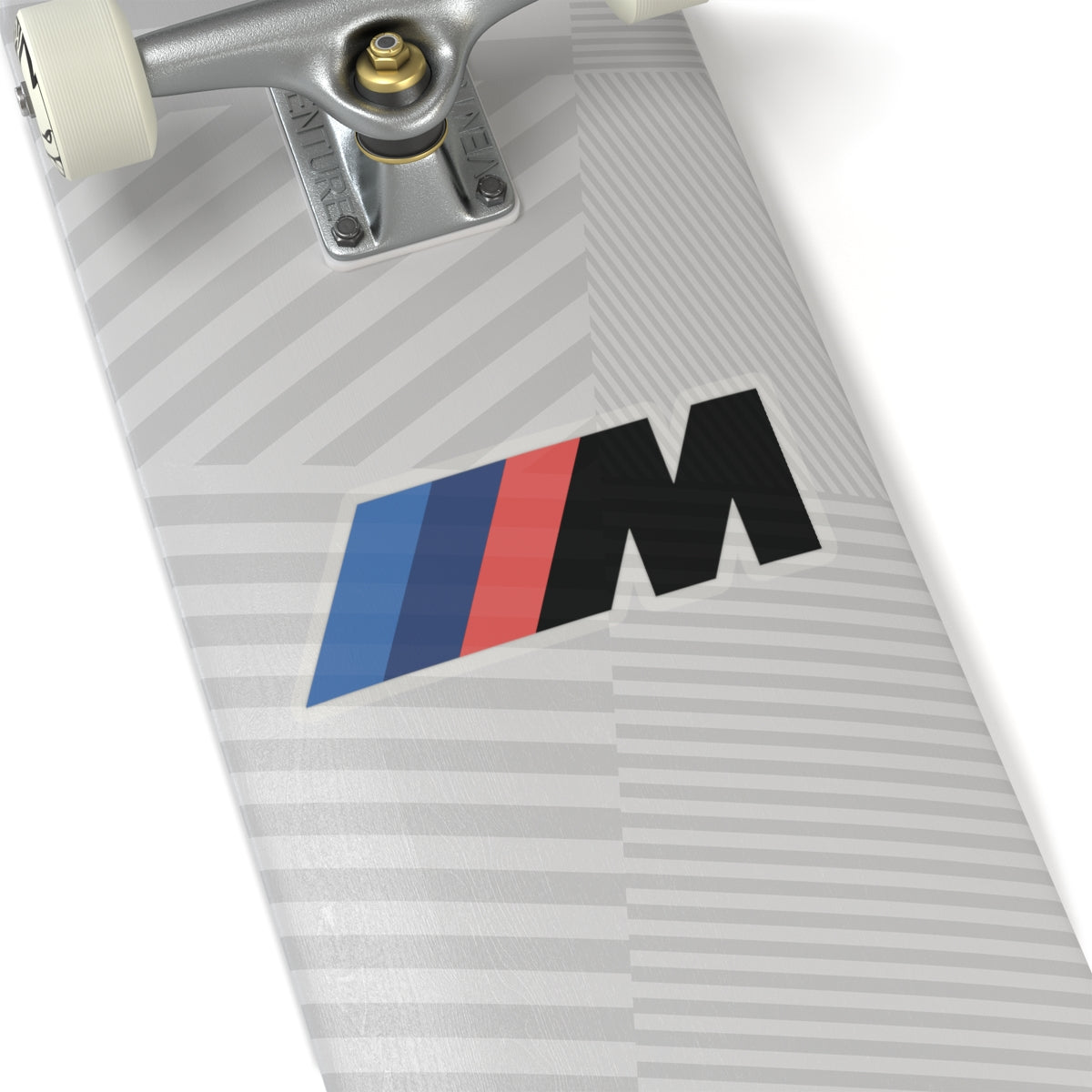 6 inch transparent sticker of the BMW Motorsport logo on skateboard for scale
