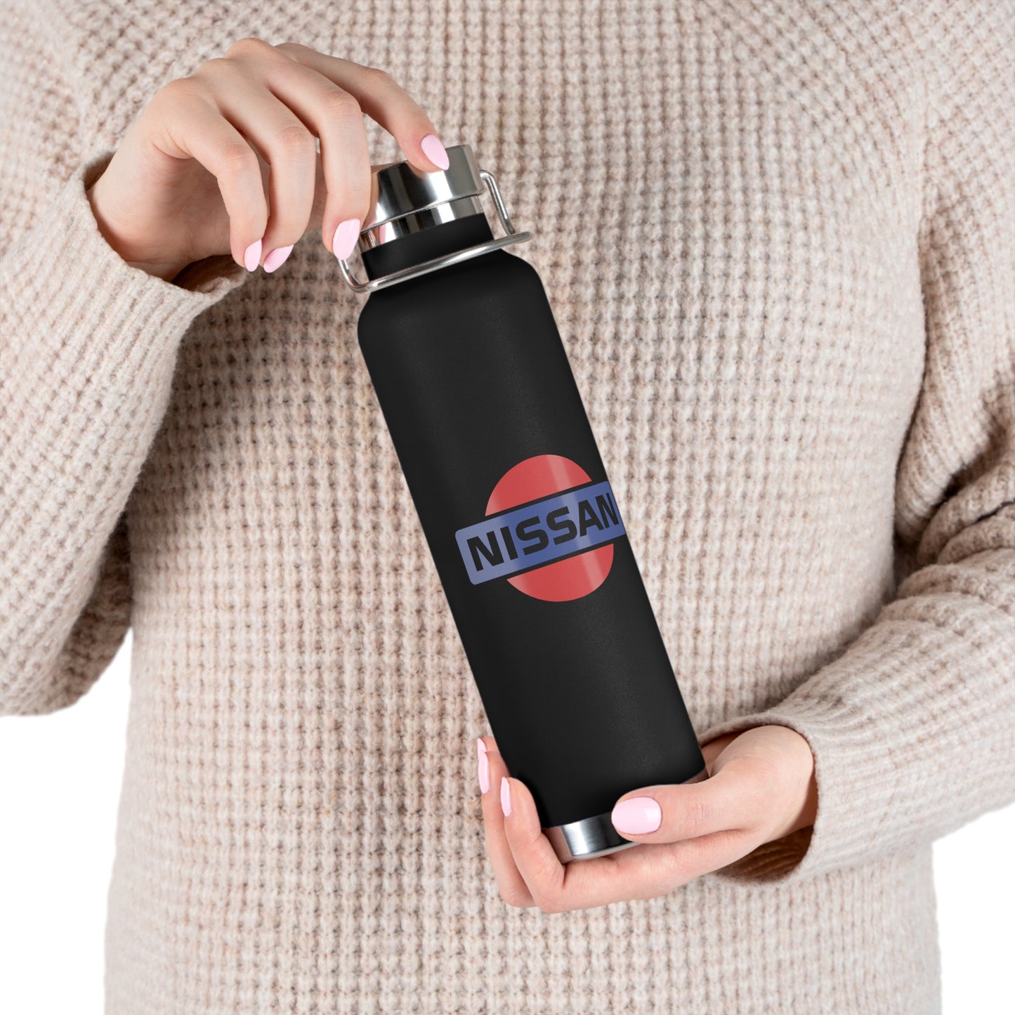 Woman holding the Black Vintage Nissan Water Bottle. The perfect gift for JDM fanatics