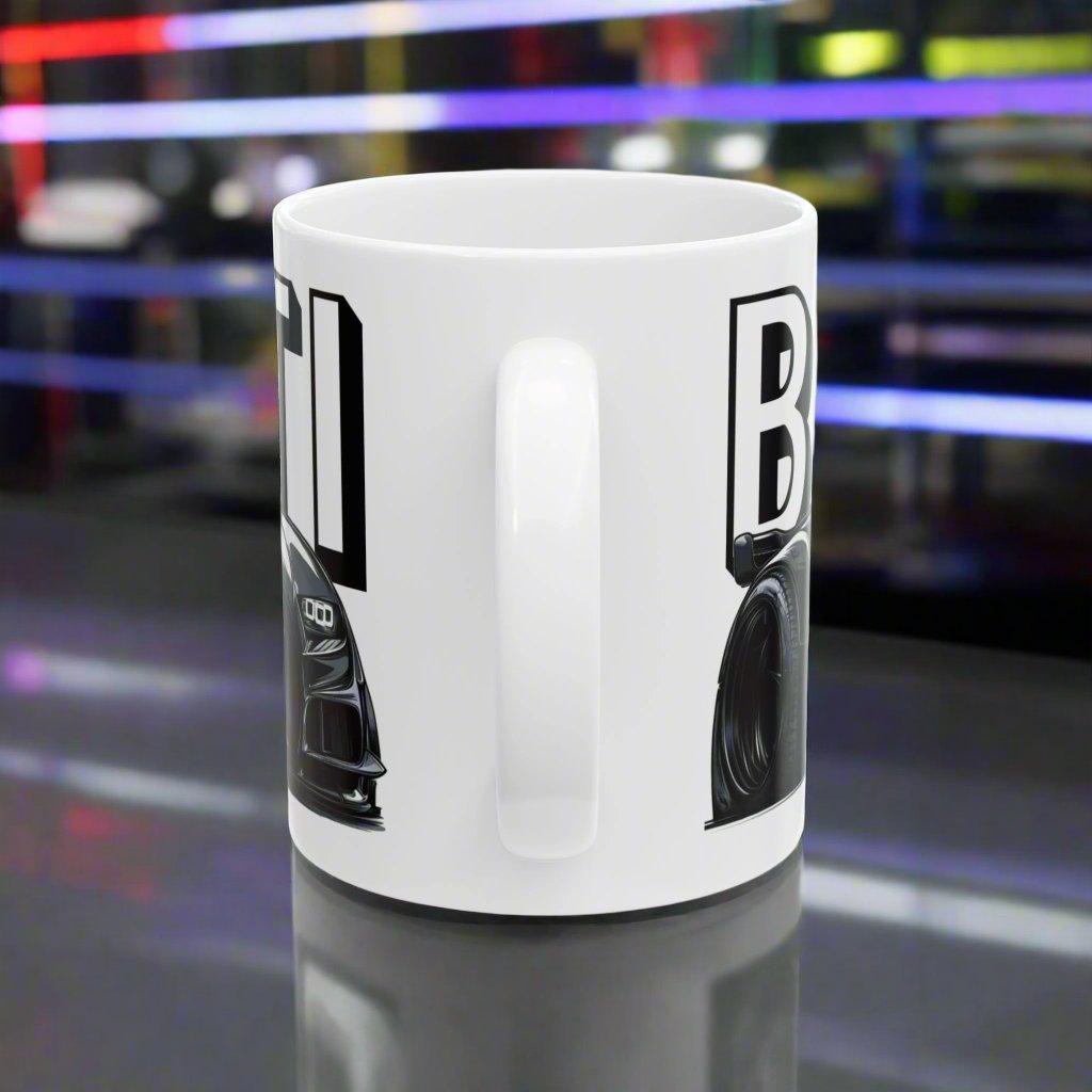 Handle View of the Bugatti Chiron Coffee Cup in a car garage. Bugatti-branded ceramic mug