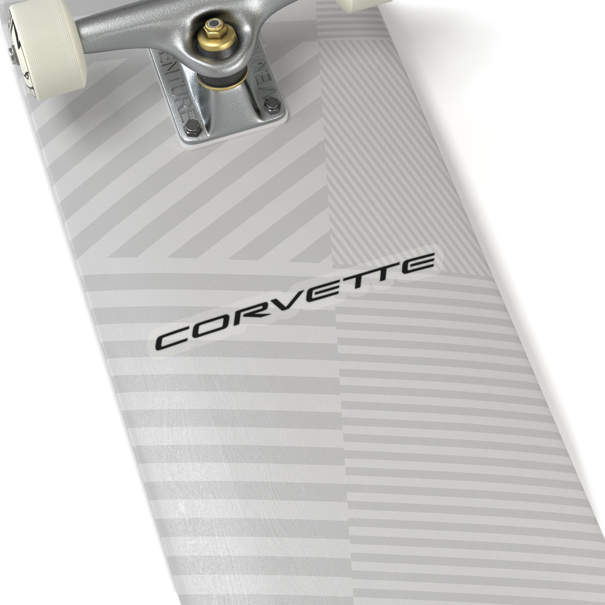 6 inch transparent Corvette sticker applied to a silver skateboard, showcasing its size and placement.