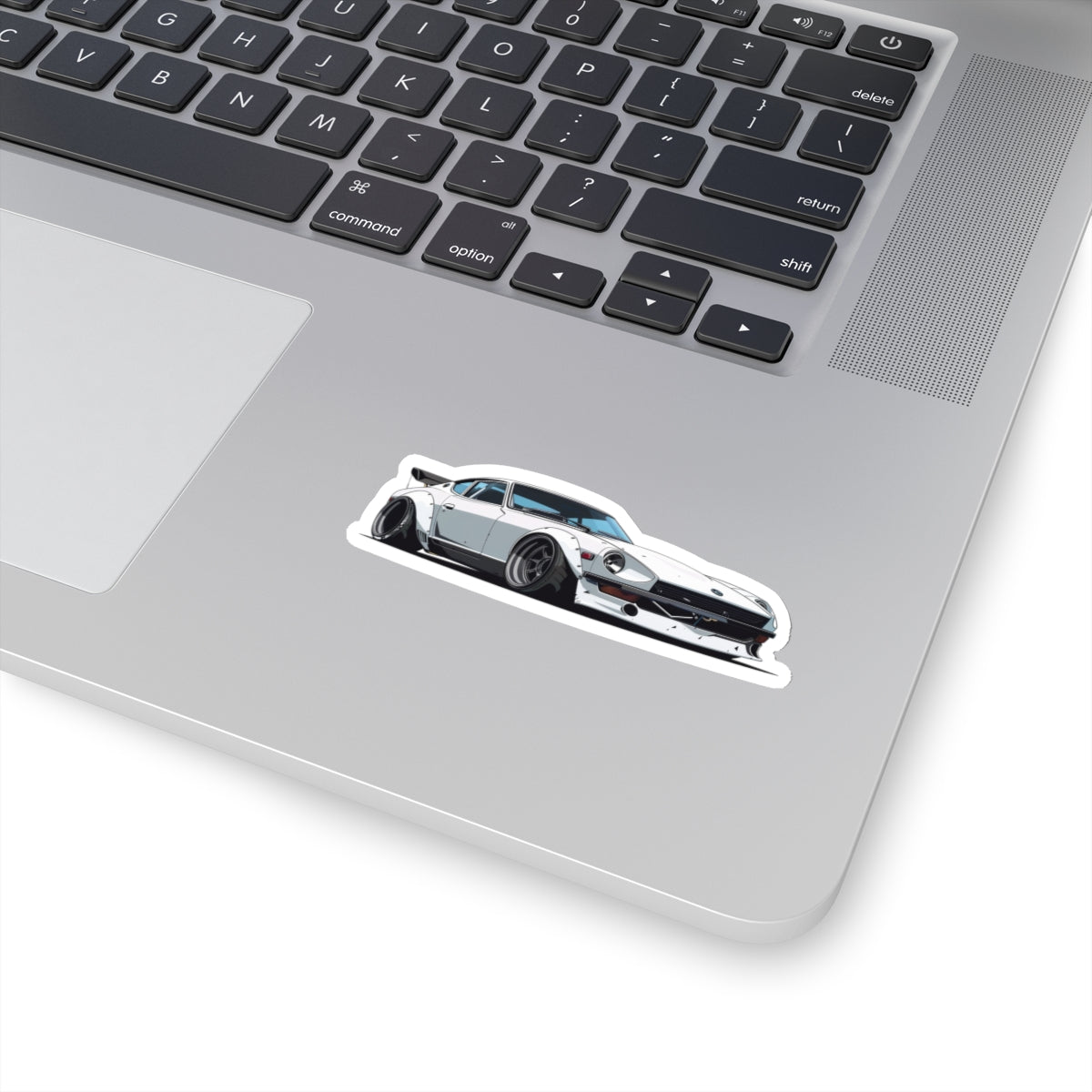 3 inch white Datsun 240z sticker on a silver laptop