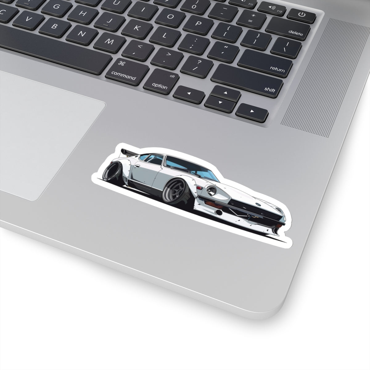 4 inch white Datsun 240z sticker on a silver laptop