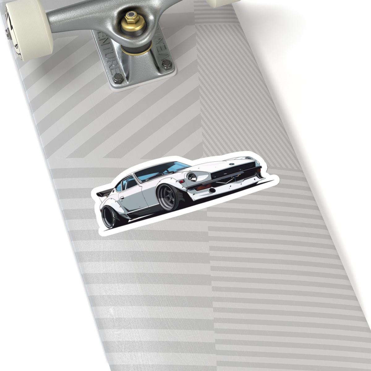 6 inch white Datsun 240z sticker on a silver skateboard deck