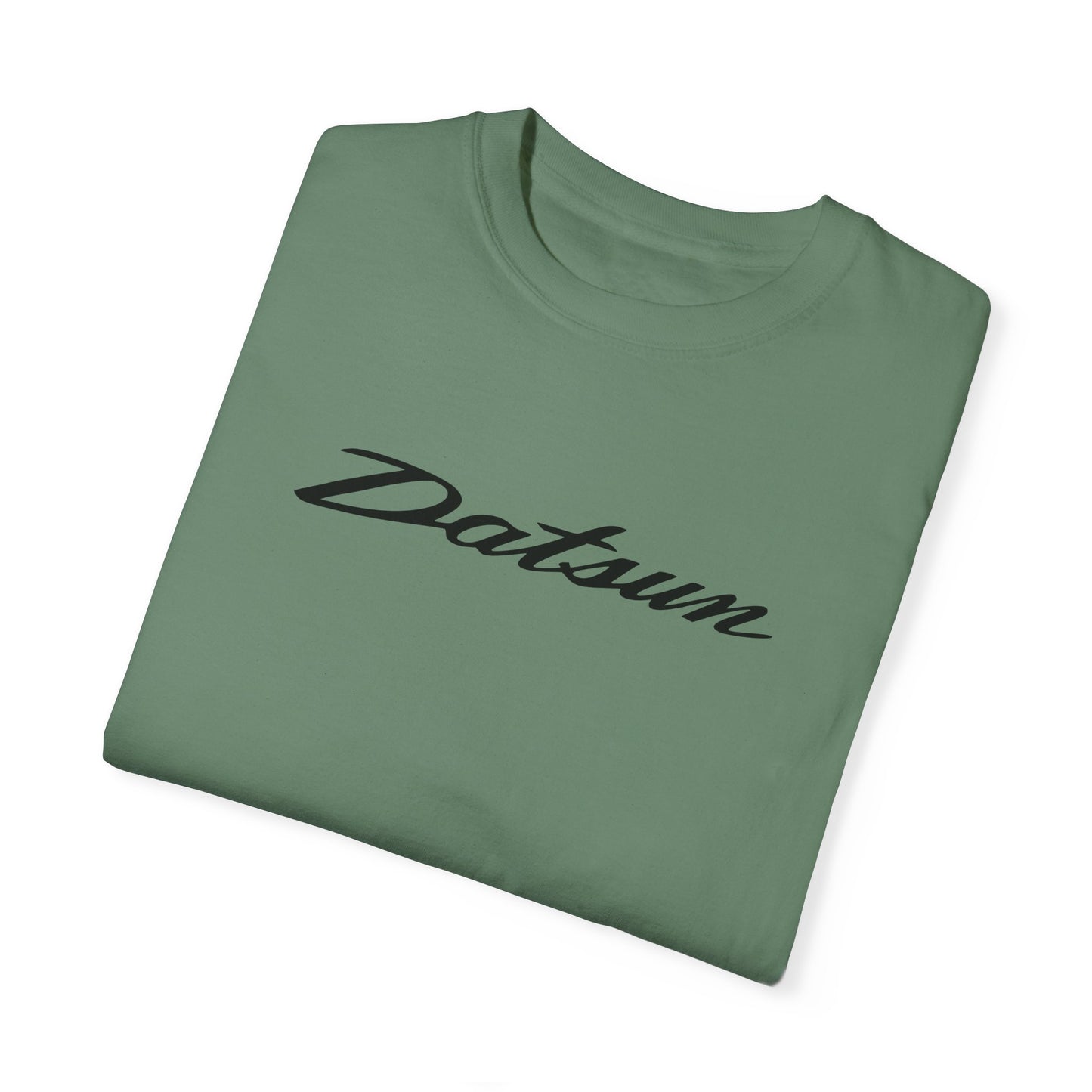 Green Datsun T-Shirt with black text, folded.
