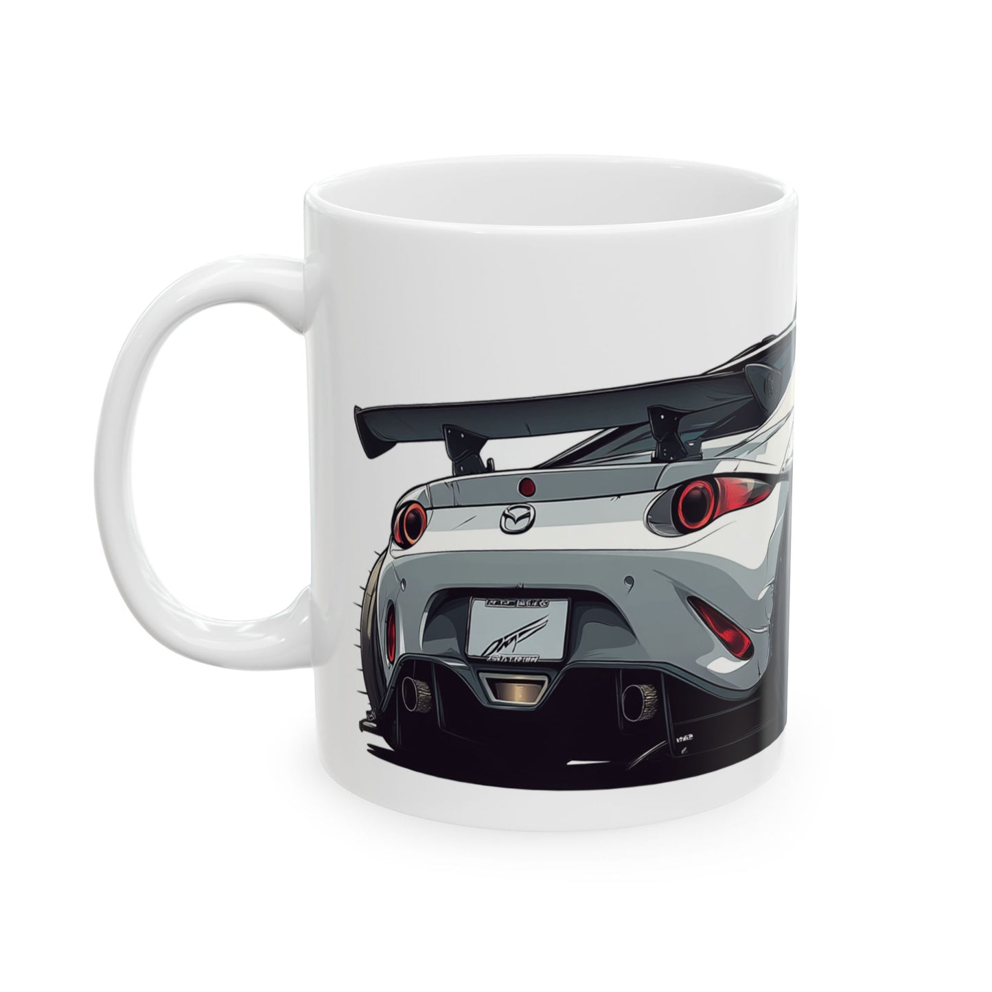 Left view of 11oz White Coffee Mug with a Mazda MX-5 with the MX-5 emblem placed behind the car.  