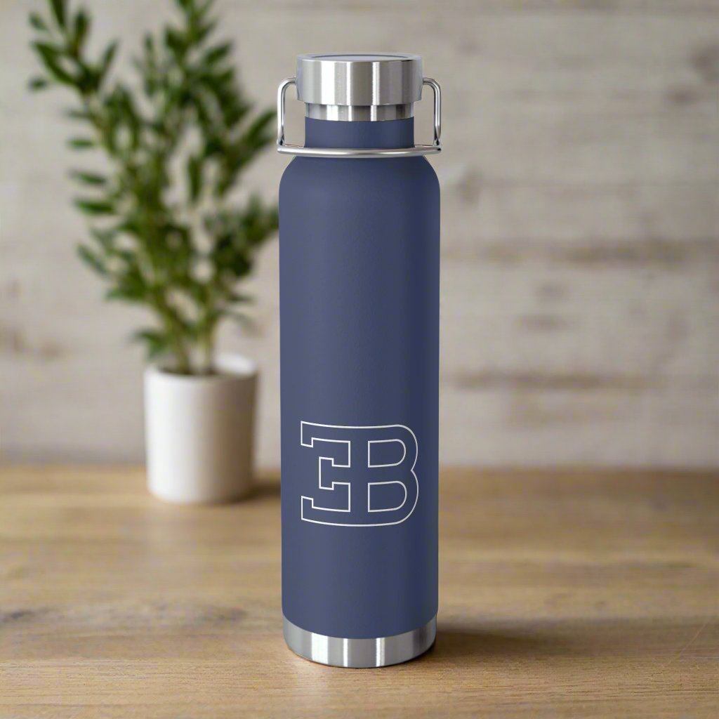 Front View of Navy Bugatti Logo Water Bottle in a kitchen. Copper Vacuum Insulated. Luxury Bugatti merchandise for collectors