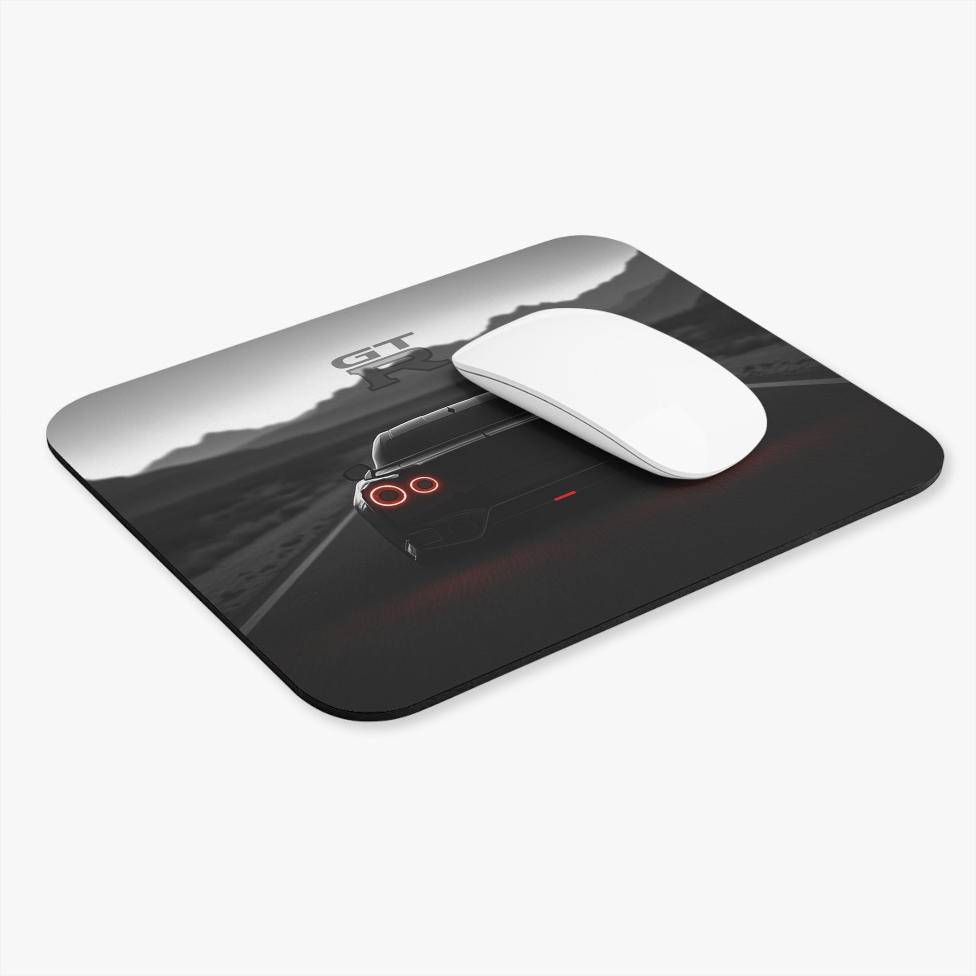 Angled view of the Black Rear end of a Nissan GTR mouse pad on a white background