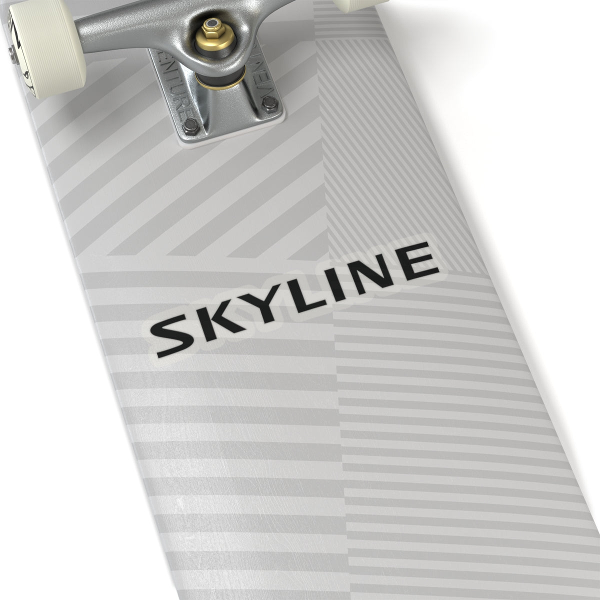 6 inch transparent Nissan Skyline sticker place on a silver skateboard deck