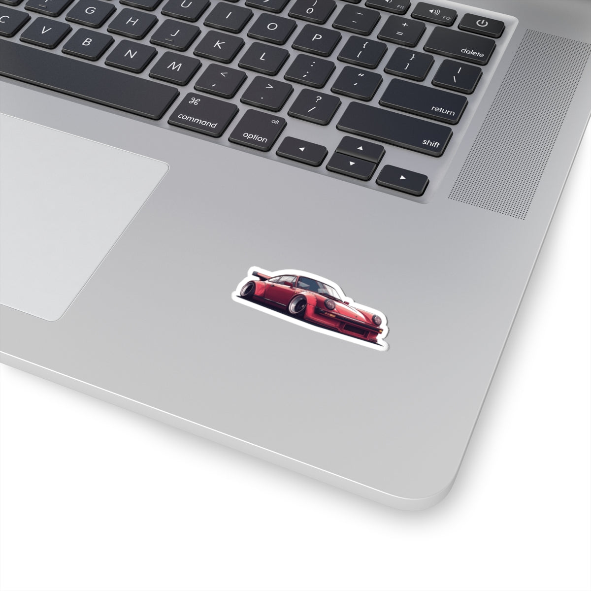 2 inch white Porsche 930 sticker on a silver laptop