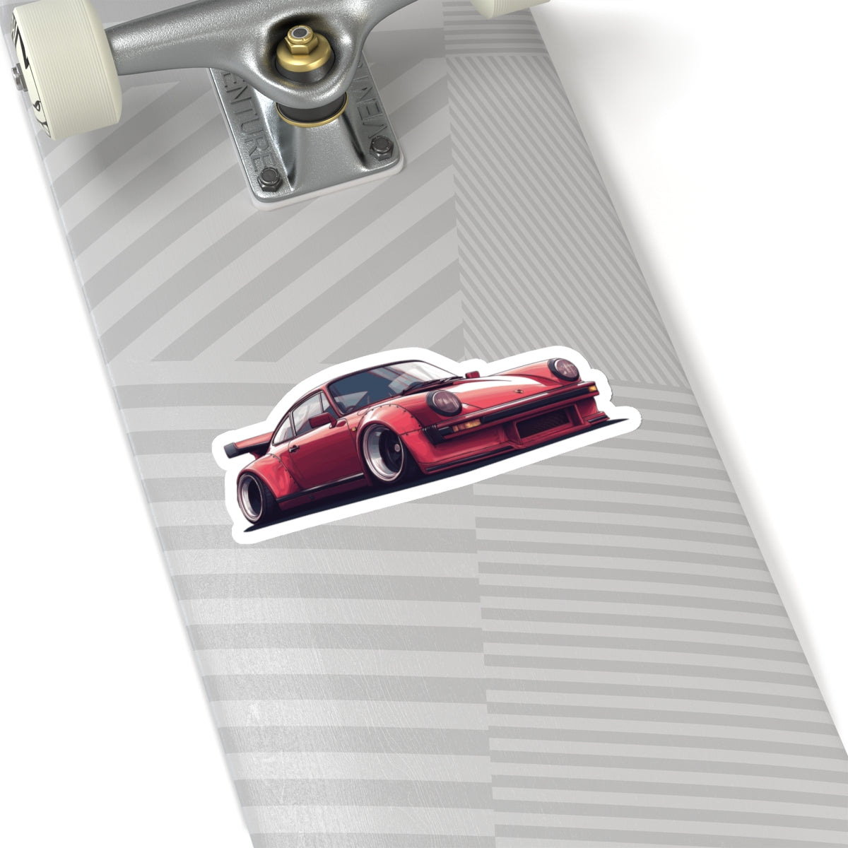 6 inch white Porsche 930 sticker on a silver skateboard deck