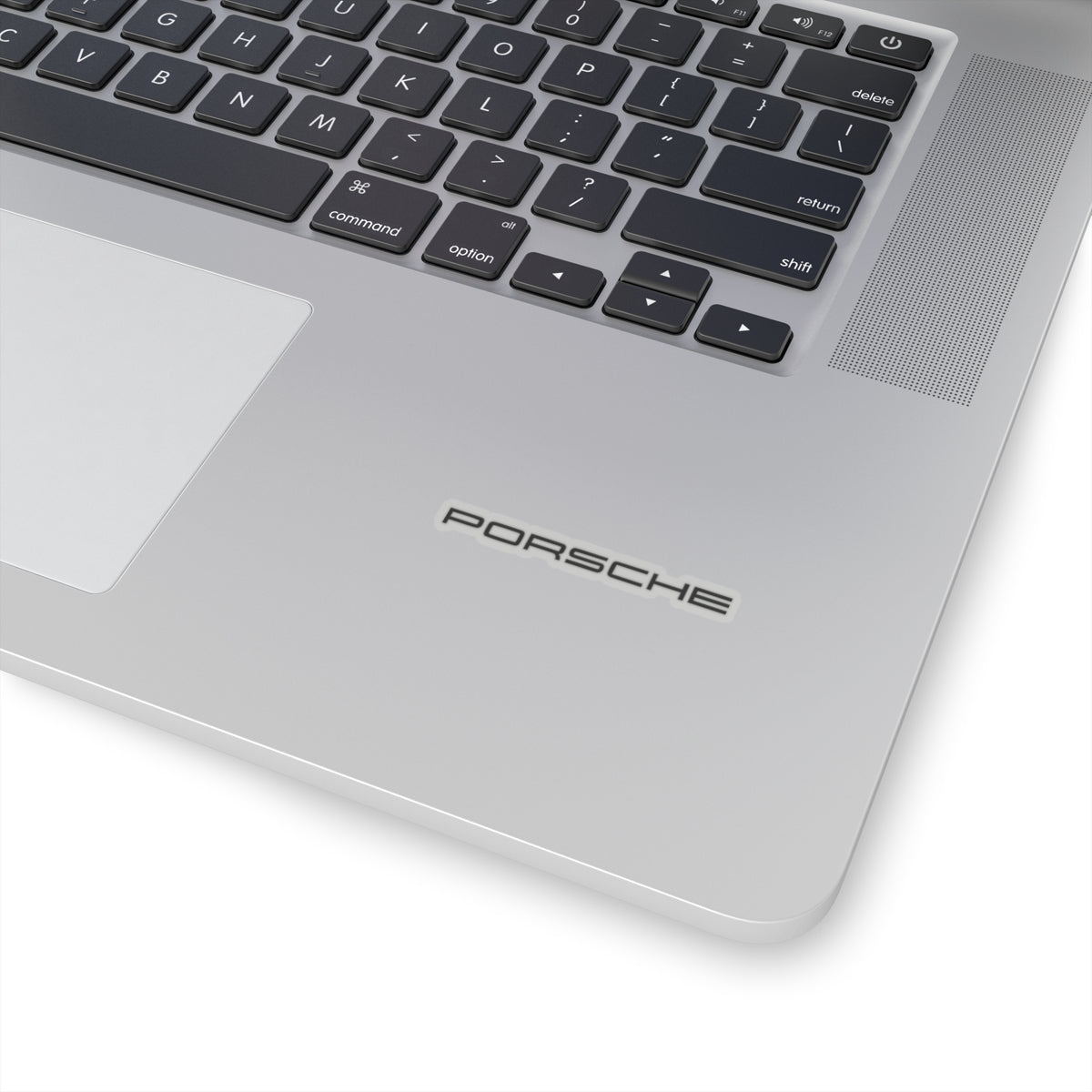 2 inch Transparent Porsche text logo sticker on laptop for scale
