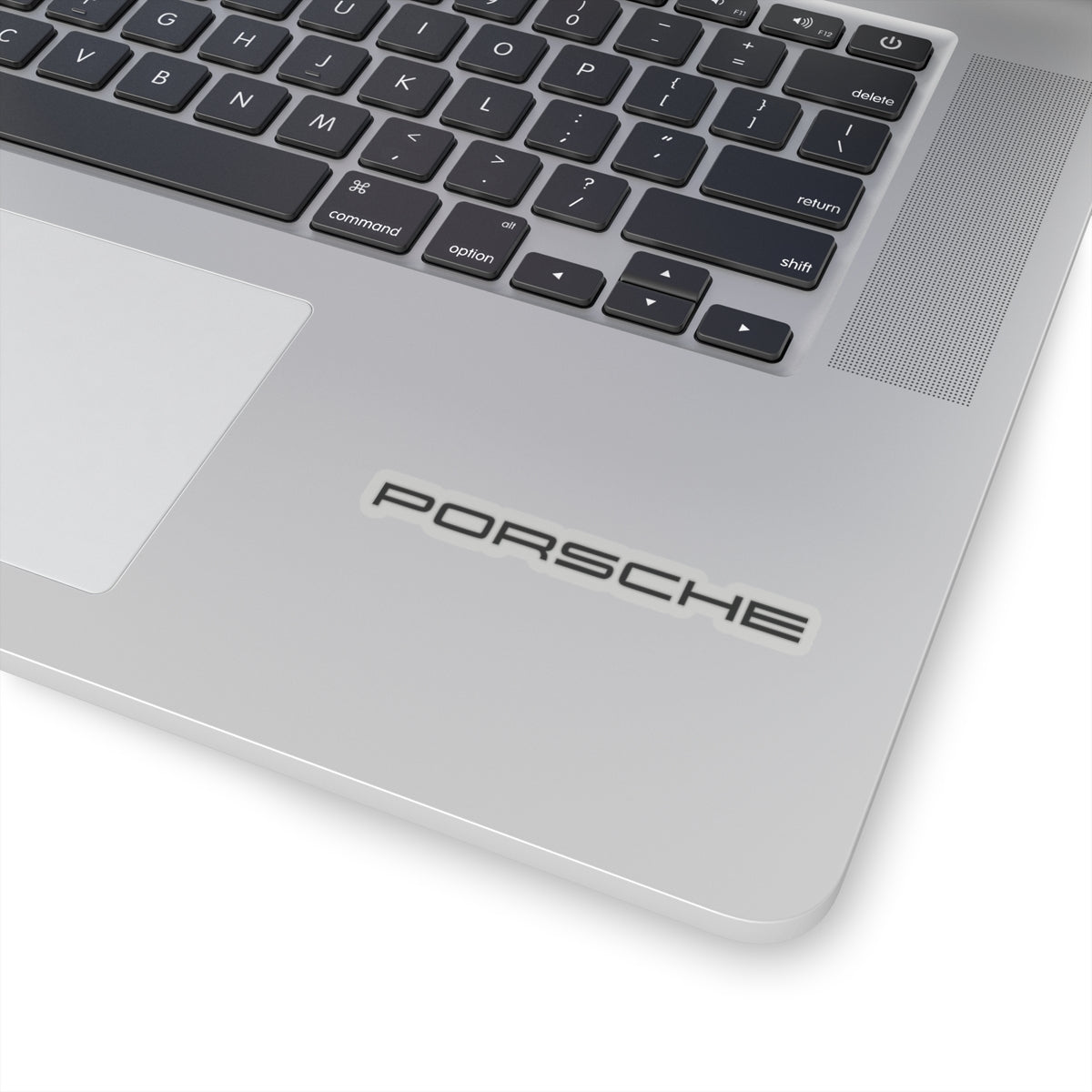 3 inch Transparent Porsche text logo sticker on laptop for scale
