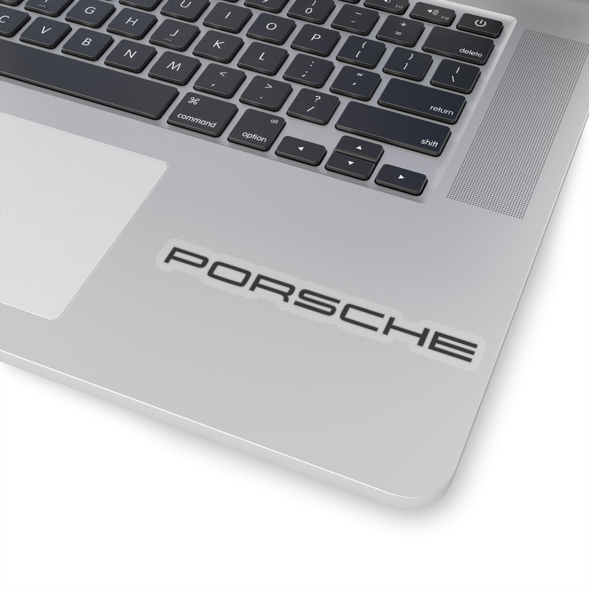 4 inch Transparent Porsche text logo sticker on laptop for scale
