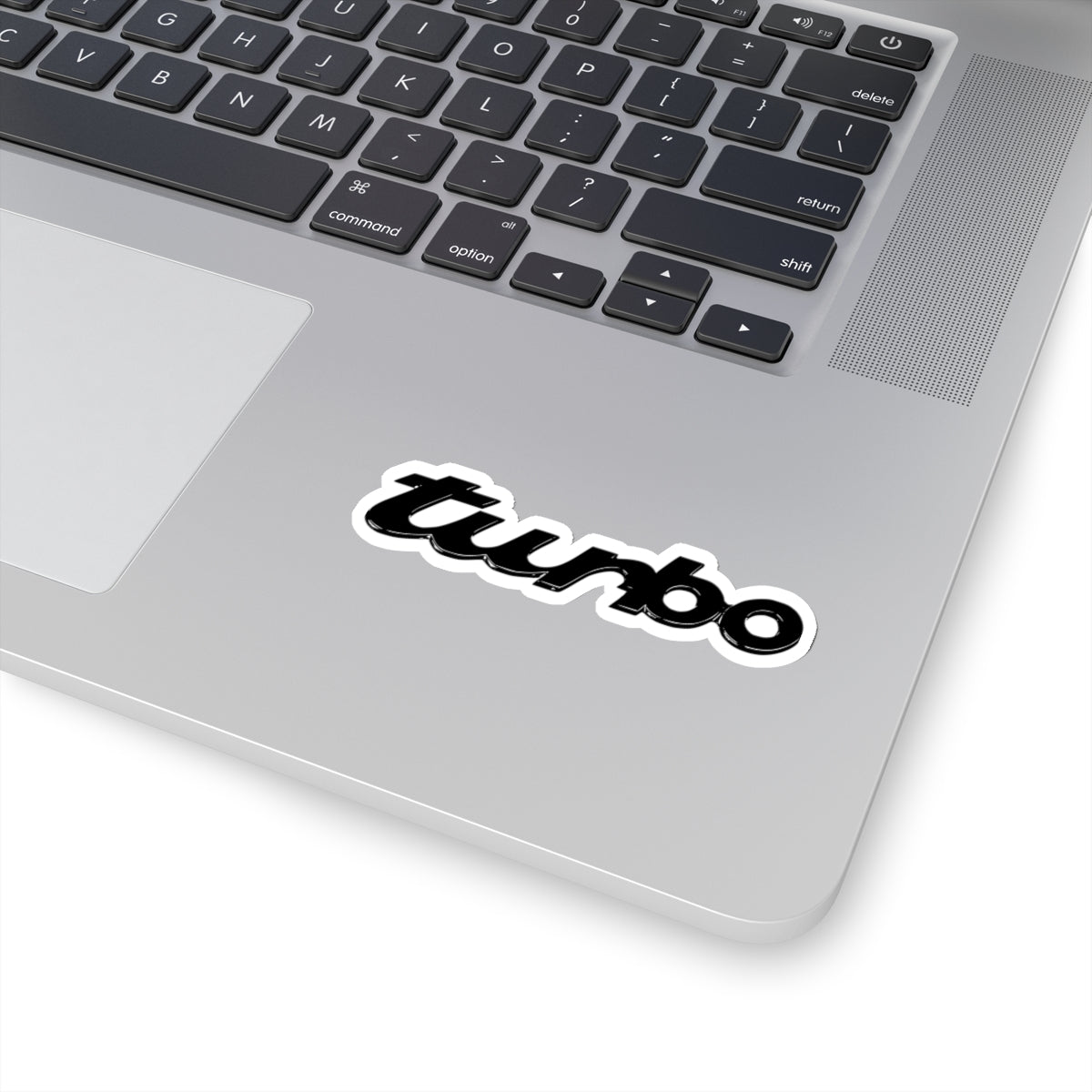 3 inch white Porsche Turbo sticker on a silver laptop