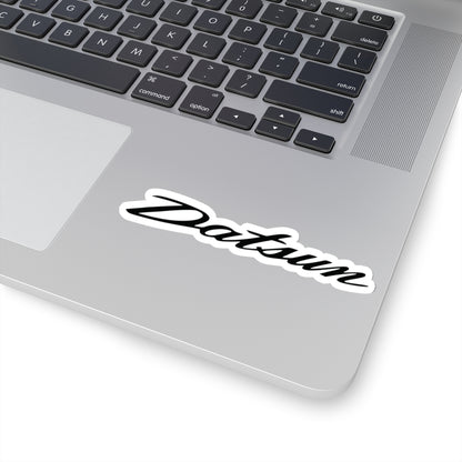 4 inch white Datsun sticker on a silver laptop