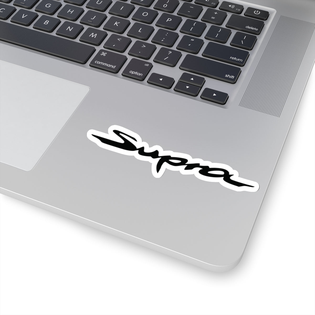 Supra Sticker on a laptop near keyboard