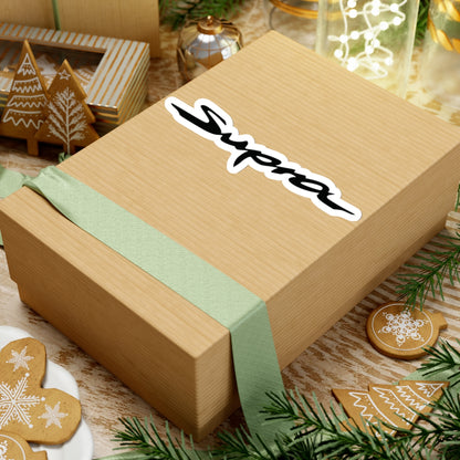 Supra Sticker on a gift box with green ribbon