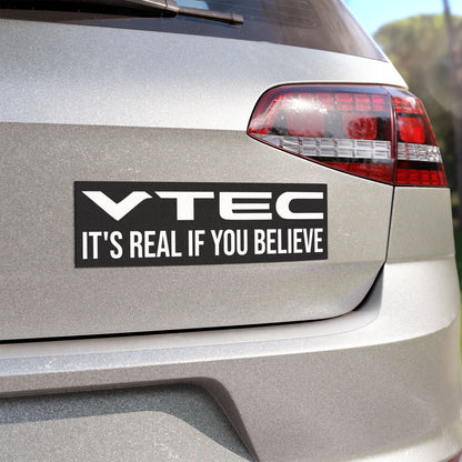 Black with white text on an Angled view of the VTEC It's Real If You Believe Magnet on the rear end of a car