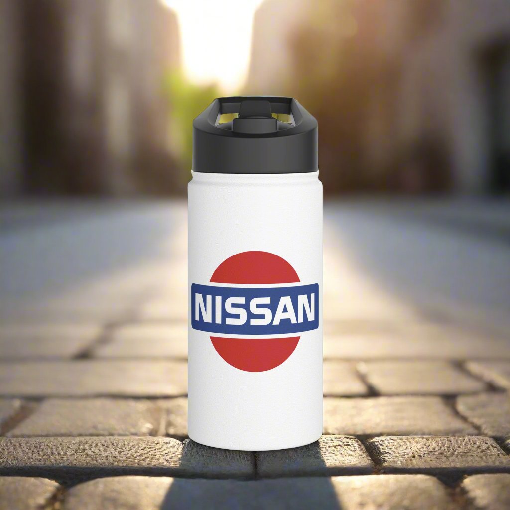 Front View of White Vintage Nissan Logo Water Bottle on a brick pathway. Automotive-Themed Water Bottle.