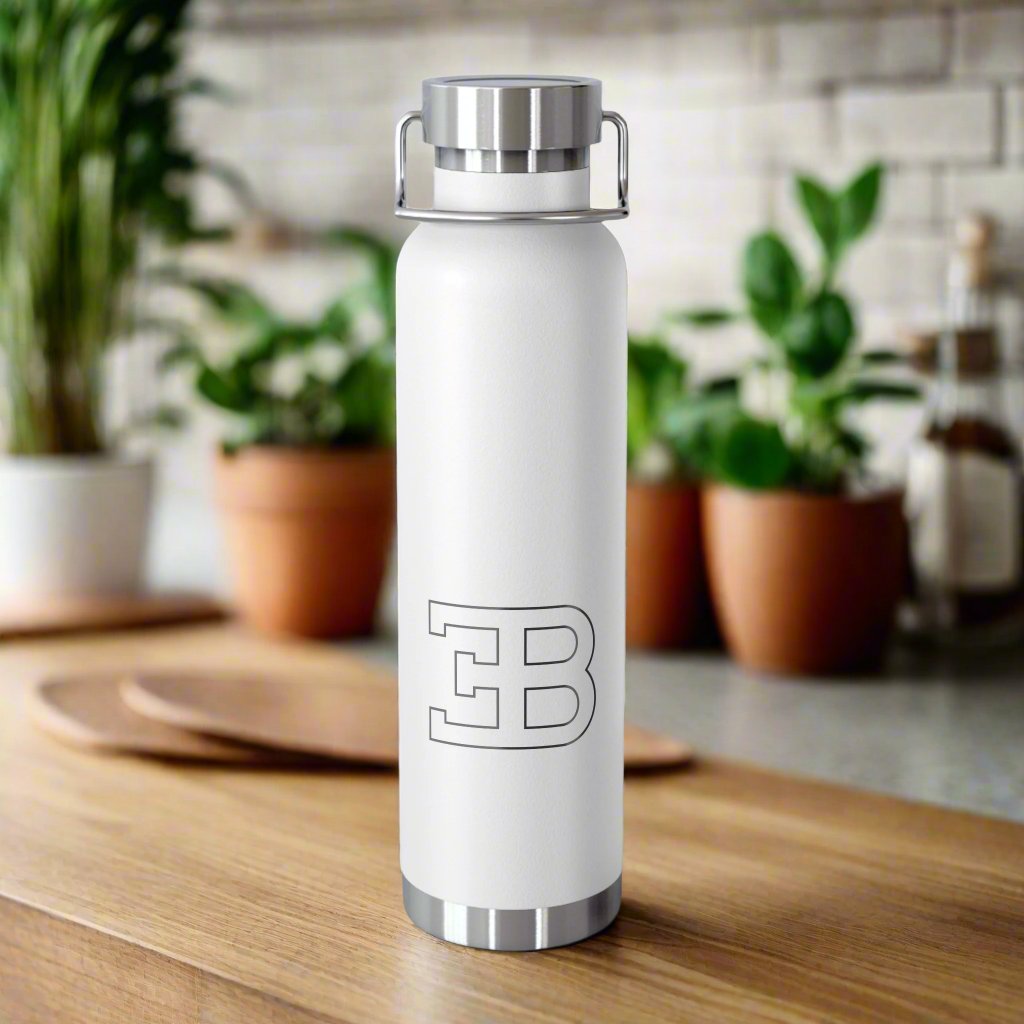 Front View of White Bugatti Logo Water Bottle in a kitchen. Copper Vacuum Insulated. High-quality Bugatti drinkware.